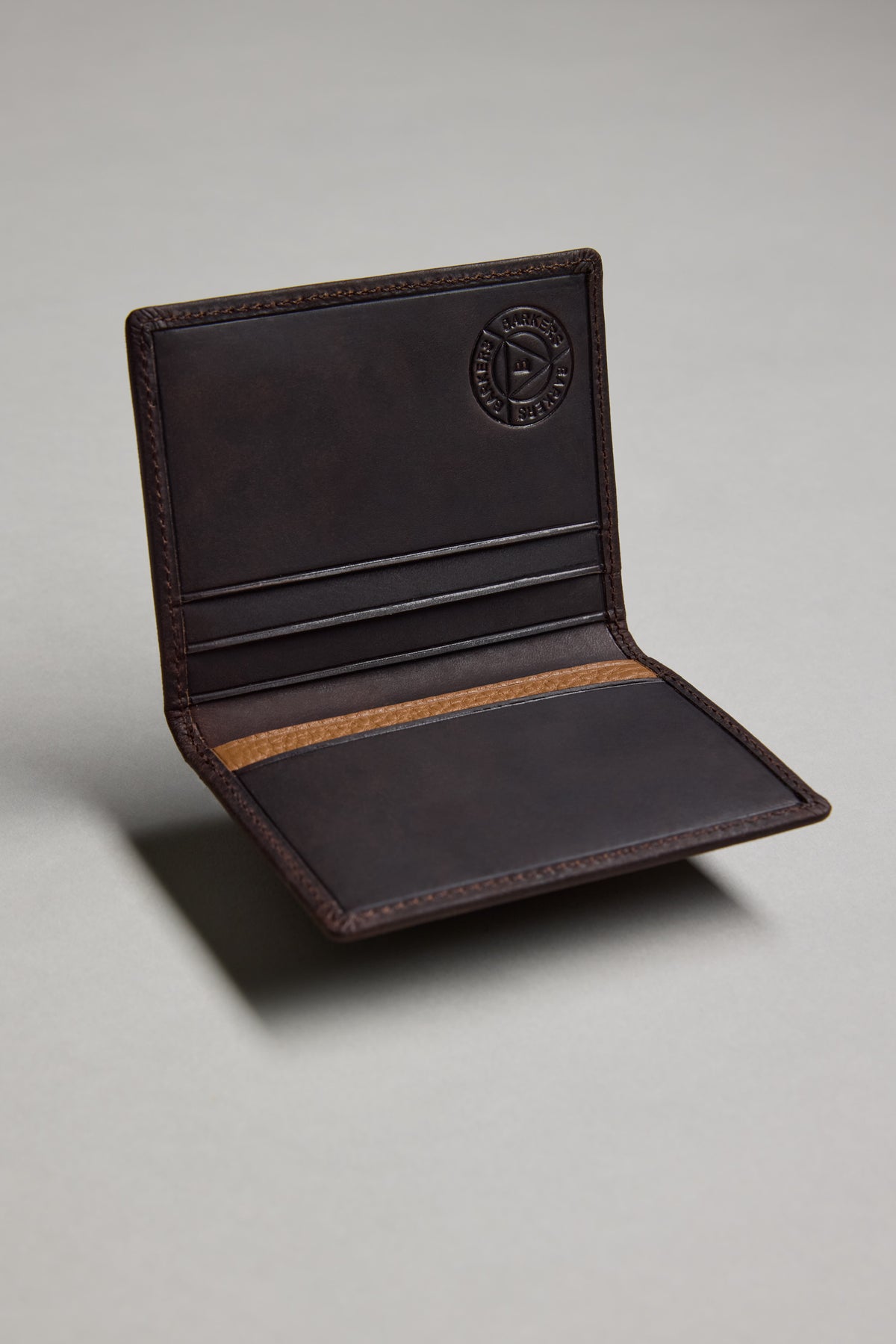 Open Barkers Marlin Leather Slim Wallet, dark brown, with card slots on a plain gray background.