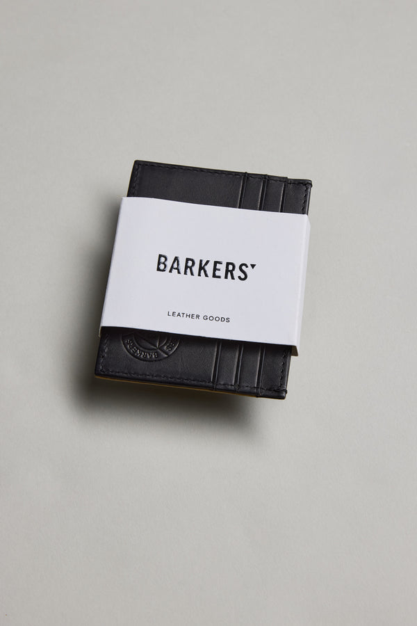 Black Taylor Leather Card Wallet by Barkers with a white band, on a light background.