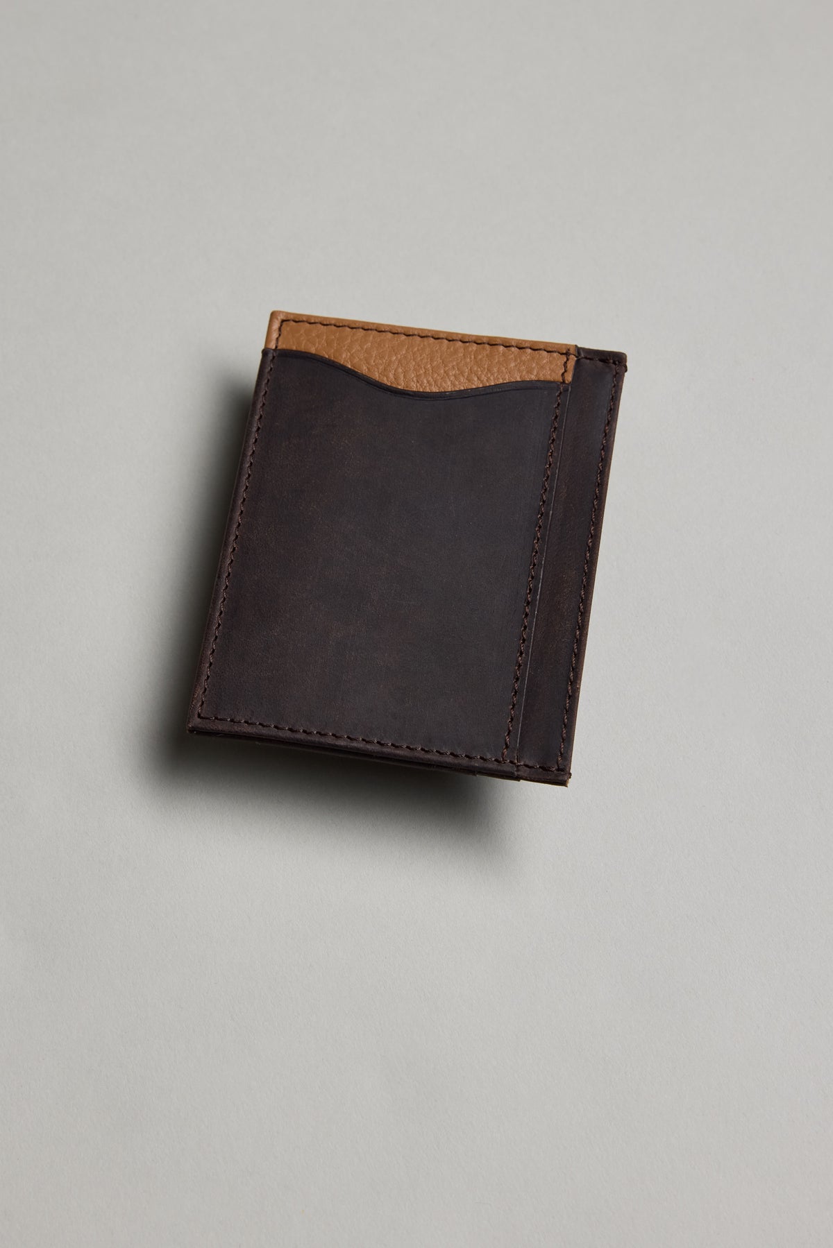 The Barkers Taylor Leather Card Wallet in brown with tan accent sits on a light gray surface.