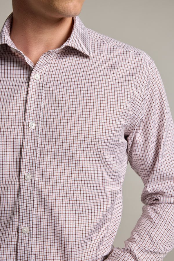 A man models the Barkers Marbury Check Business Shirt—a light-colored, long-sleeve, tailored fit shirt with a small check pattern—shown from chest to chin against a plain background.
