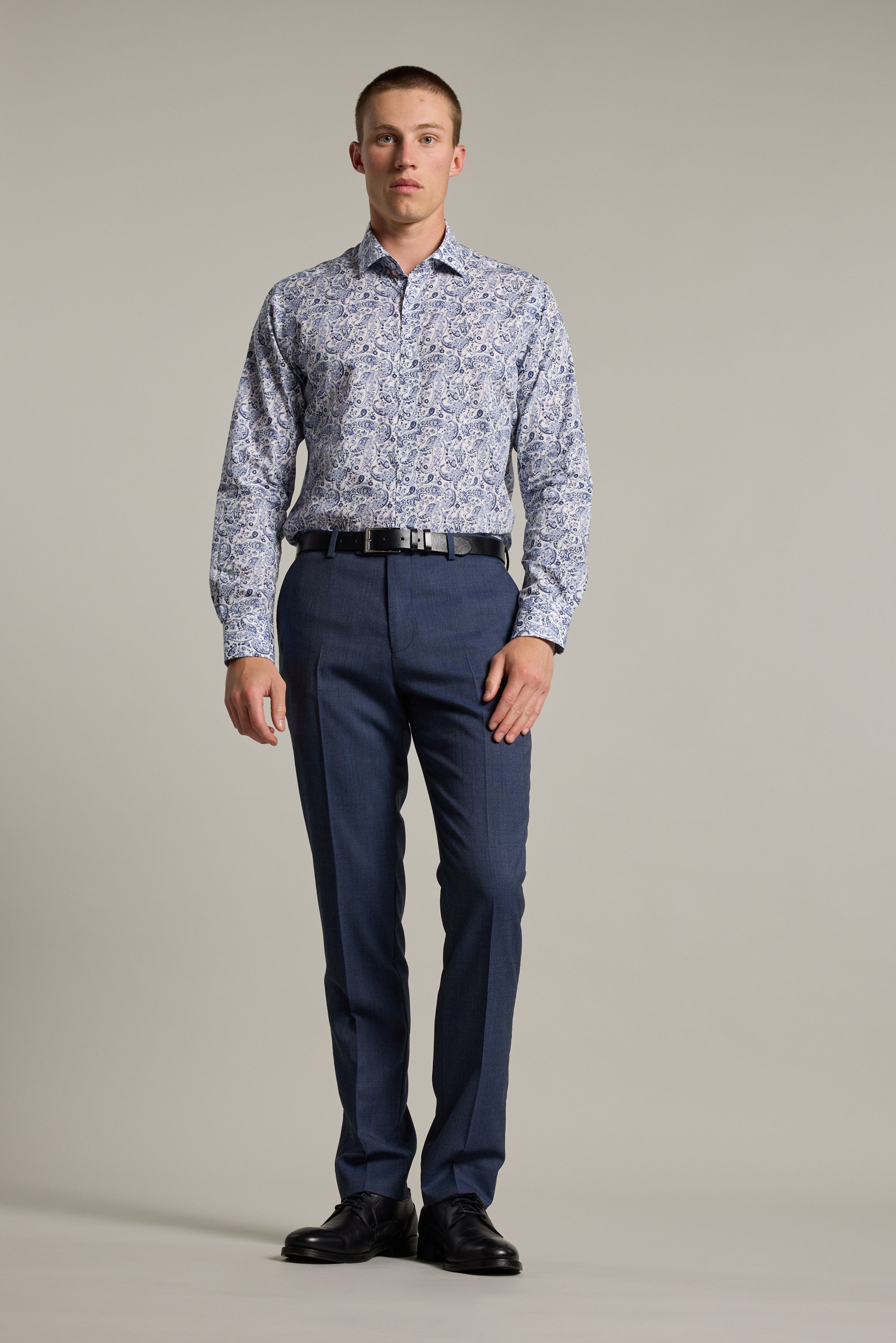 A man wearing the Buckman Print Business Shirt by Barkers in a tailored fit floral design.