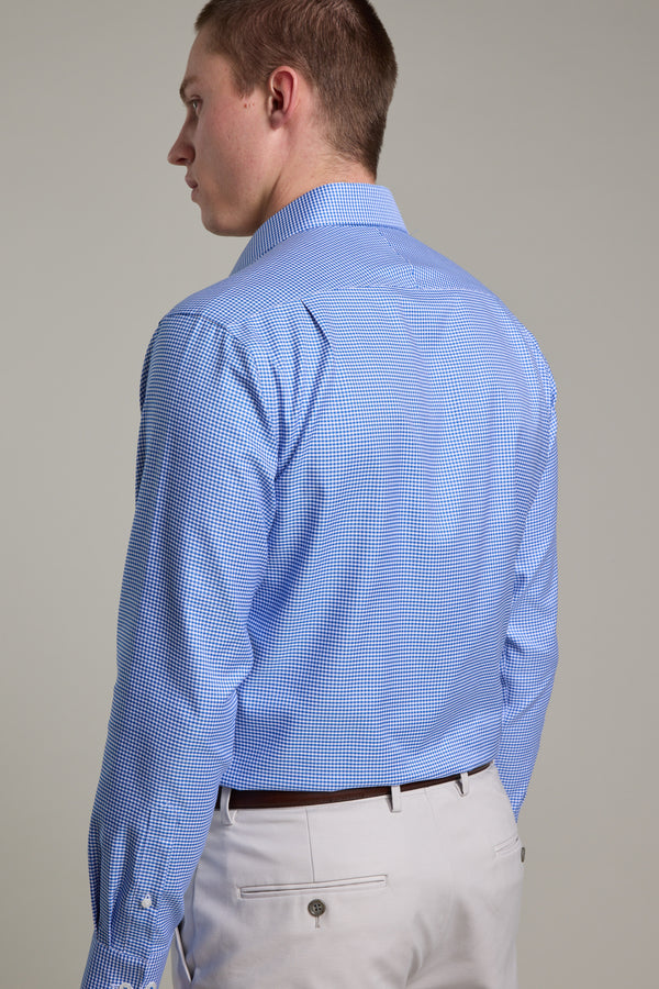 A person is seen from the back, wearing the Barkers Mitchel Check Business Shirt in light blue and beige pants, facing slightly left against a plain light background.