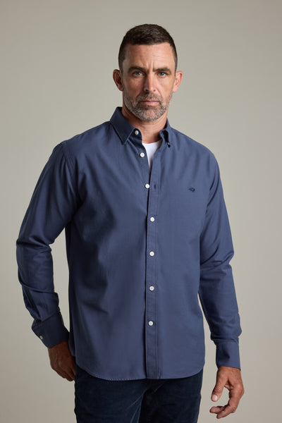 Man with short hair and beard in Barkers Maynard Oxford Shirt, classic fit, blue background.