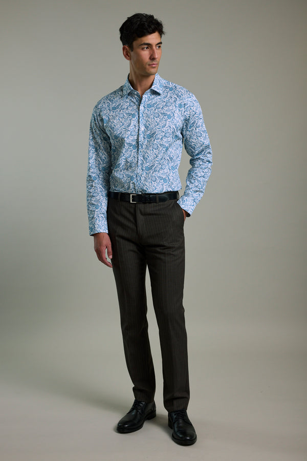 Man wears a Barkers Ronton Print Business Shirt, dark trousers, and black shoes in studio.
