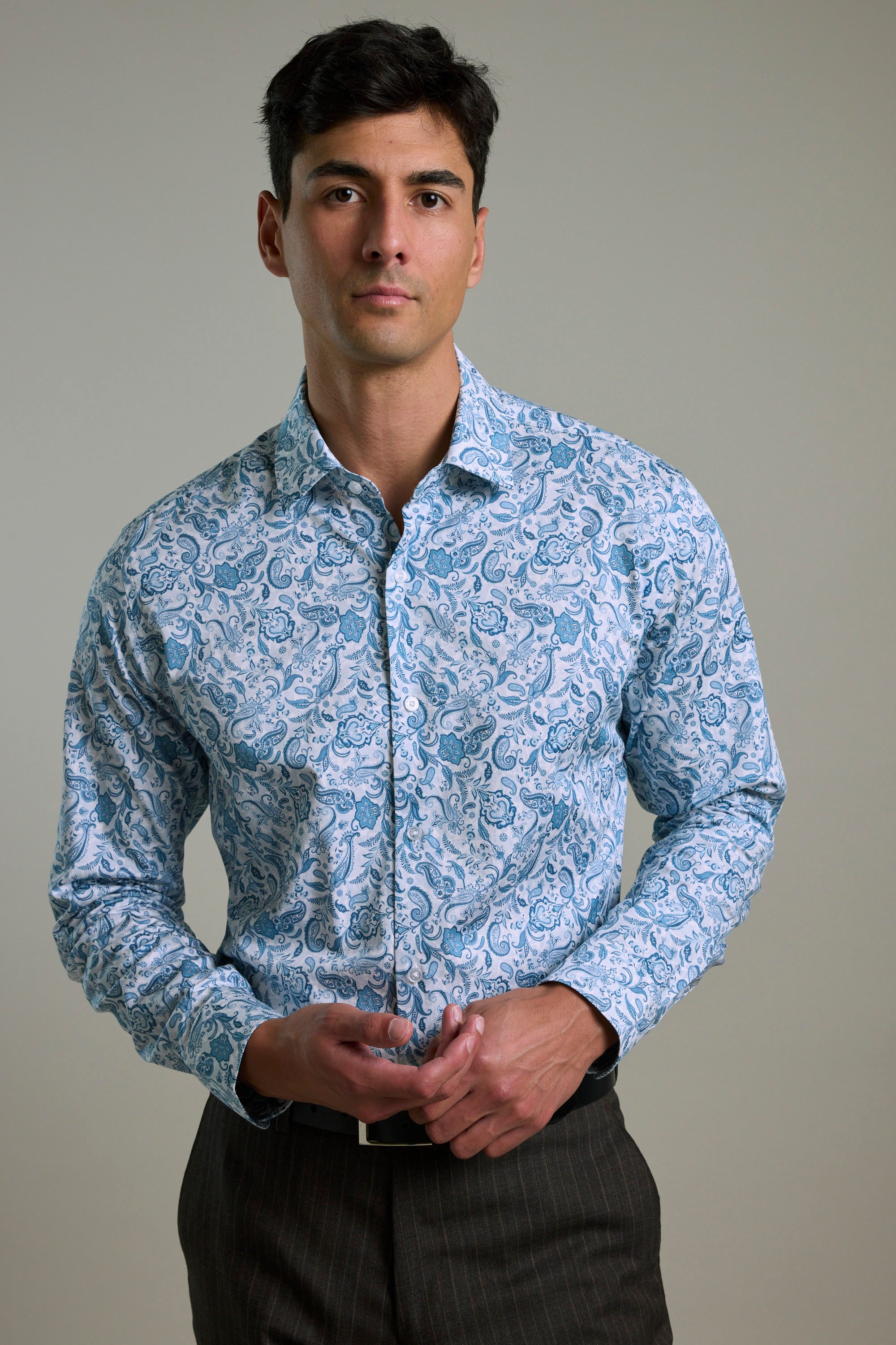 Man wears Barkers Ronton Print Business Shirt, tailored fit, with dark trousers.