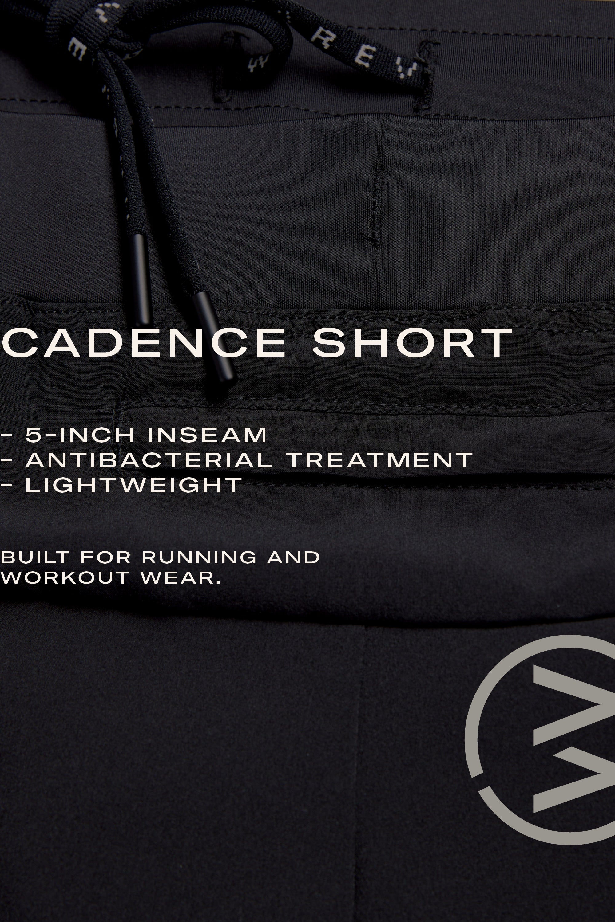 Close-up of WearEver Cadence Short running shorts in black with drawstrings, 5-inch inseam, antibacterial finish, and lightweight design—ideal for training or running. WearEver circular logo is featured at the bottom right corner.