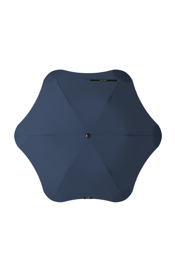 The Blunt Metro Umbrella by Blunt, featuring a modern six-sided navy blue canopy, is viewed from above against a white background.