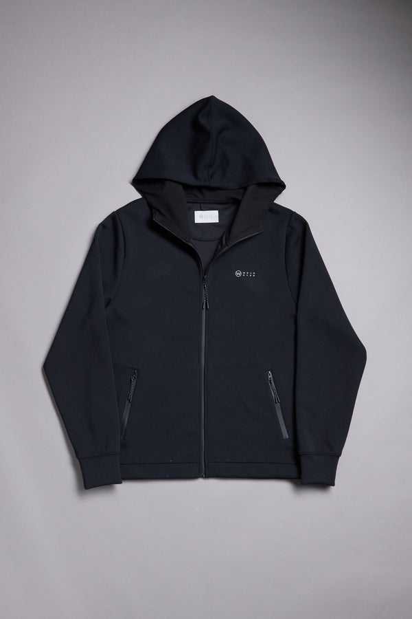 The WearEver Altitude Hoody by WearEver is a black tech fleece zip-up jacket with long sleeves, two front zip pockets, and a small logo/text on the left chest—an ideal everyday layer, shown laid flat on a light gray background.
