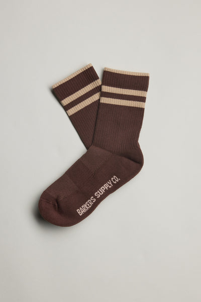 Emerson Sport Sock by Barkers in brown with beige stripes and brand text on the sole, laid flat.
