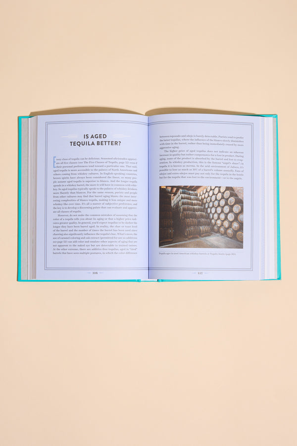 A Field Guide To Tequila by Other, open to a tequila guide and barrel photo.