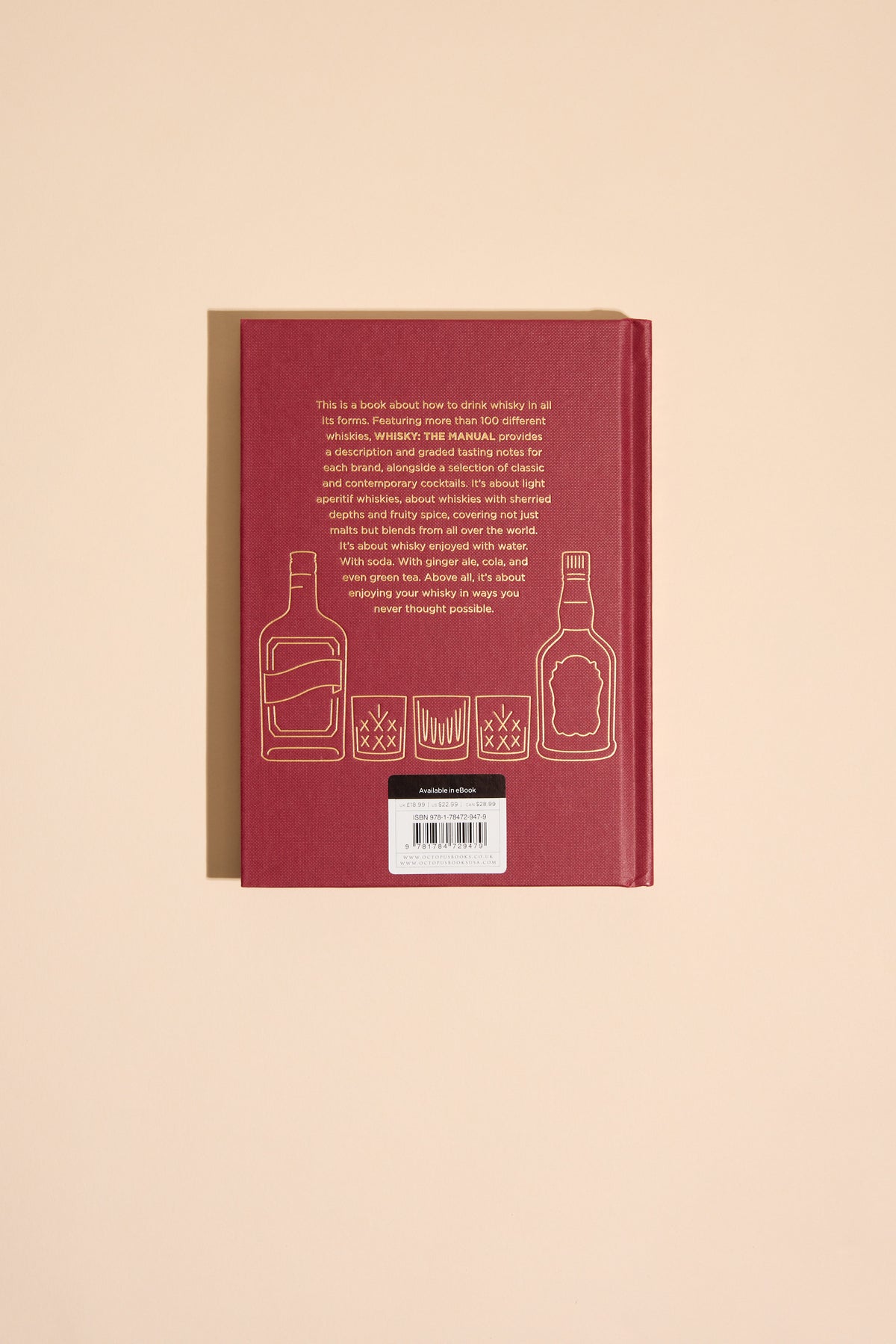 Whisky The Manual by Other: Red book with gold whisky glass icons, perfect for tasting notes.