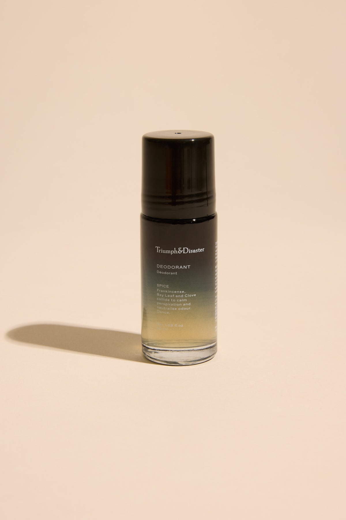 A Triumph & Disaster Deodorant V1 Spice bottle with organic ingredients on a beige background.