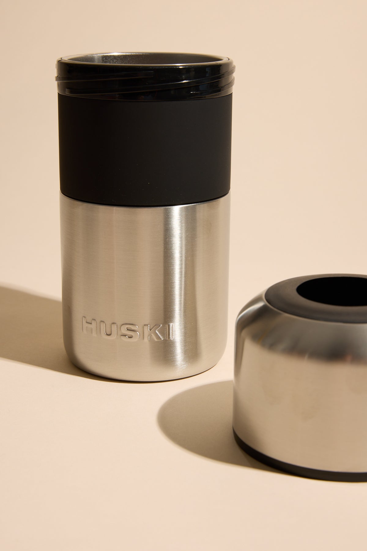 Huski Wine Cooler by Huski shown with black lid and detachable base on a neutral background.