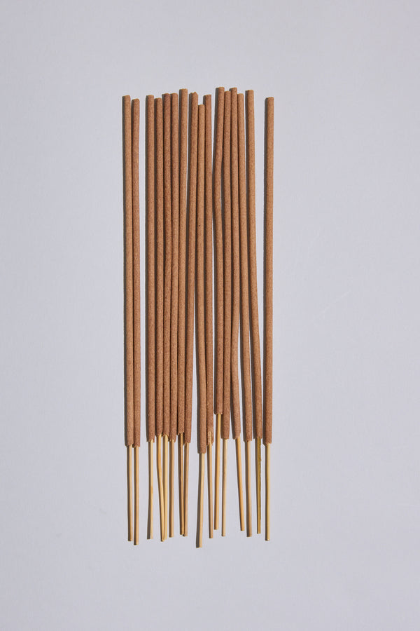 Several EoE Strand Incense Sticks by Earl of East are arranged parallel on a plain light surface, with their birchwood ends exposed at the bottom.