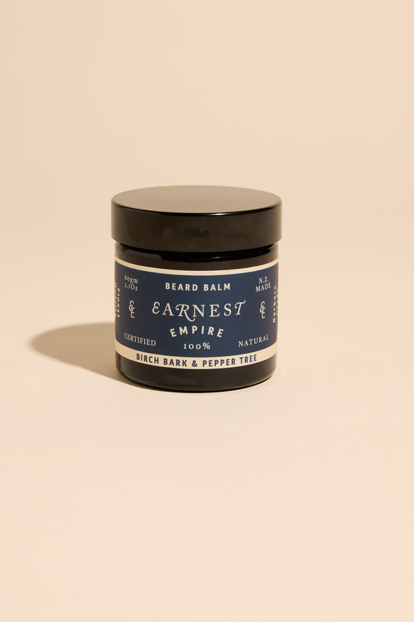 Other Earnest Empire Beard Balm, birch bark scent, displayed on a beige background.