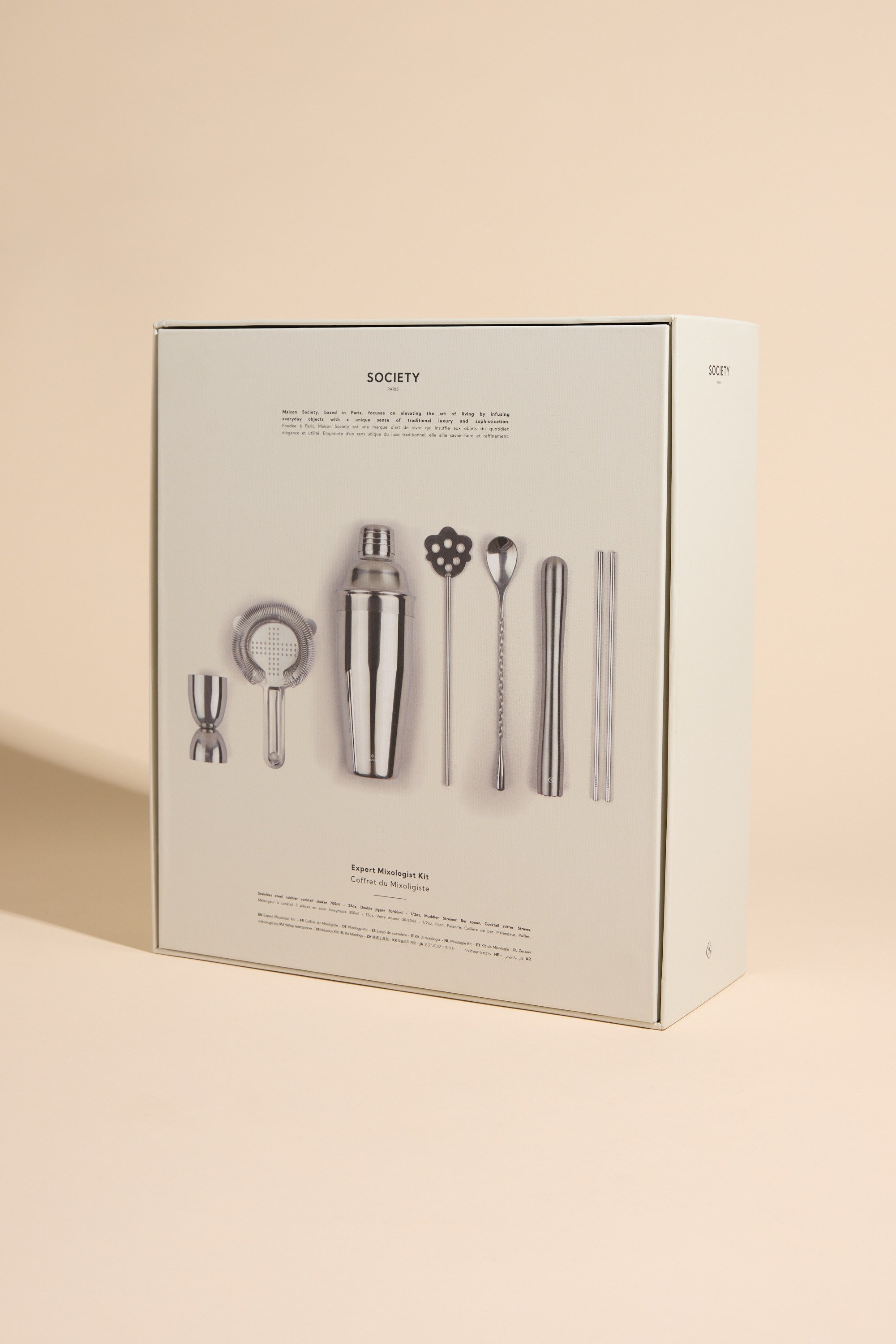 Society Paris Cocktail Mixologist Kit box with bar tools on a beige background.