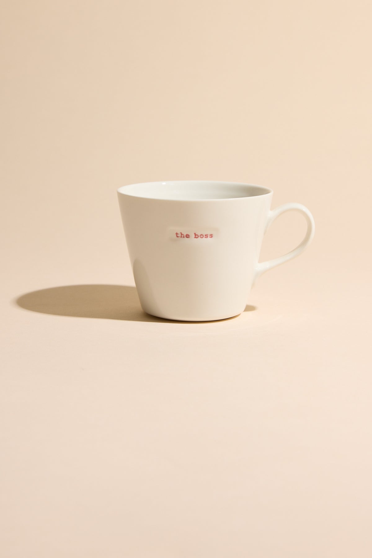 Bucket Mug - The Boss by Other, designer mug on beige background.