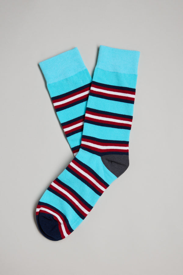 The Barkers Altona Stripe Sock features bold blue, red, white, and black stripes with solid blue cuffs, heels, and toes—perfect laid-back style for men or a great gift for dad.
