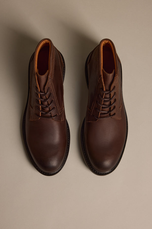The Carlton Boot by Barkers—men’s luxury brown boots in fine leather with tan lining—shown from above on a neutral background.
