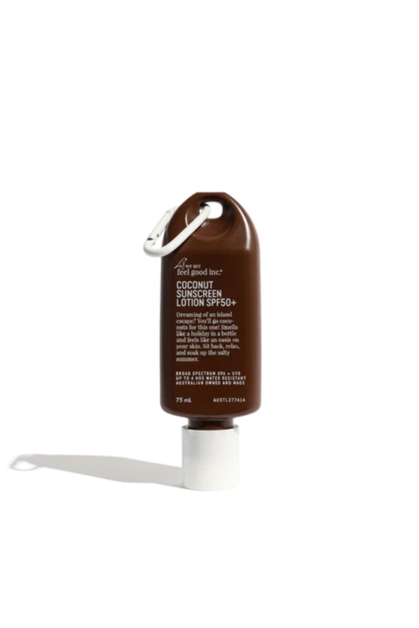 A 75ml brown bottle of Other Coconut Sunscreen Lotion SPF50+ (Traveller), made in Australia, with a silver carabiner on the cap, is standing upright on a white background.